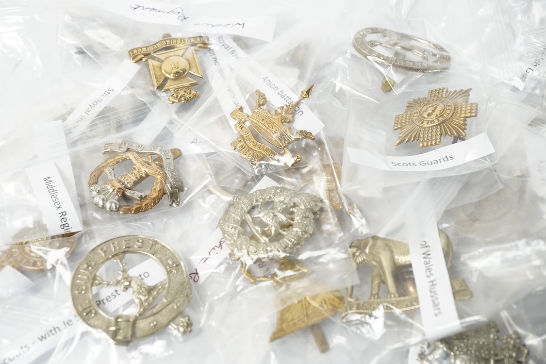 Fifty military cap badges including; the Norfolk regiment, the 16th Queen’s Lancers, Army Education Corps, Bedfordshire Yeomanry, Princess Victoria‘s Royal Irish Fusiliers, Northamptonshire Yeomanry, Royal Naval Division